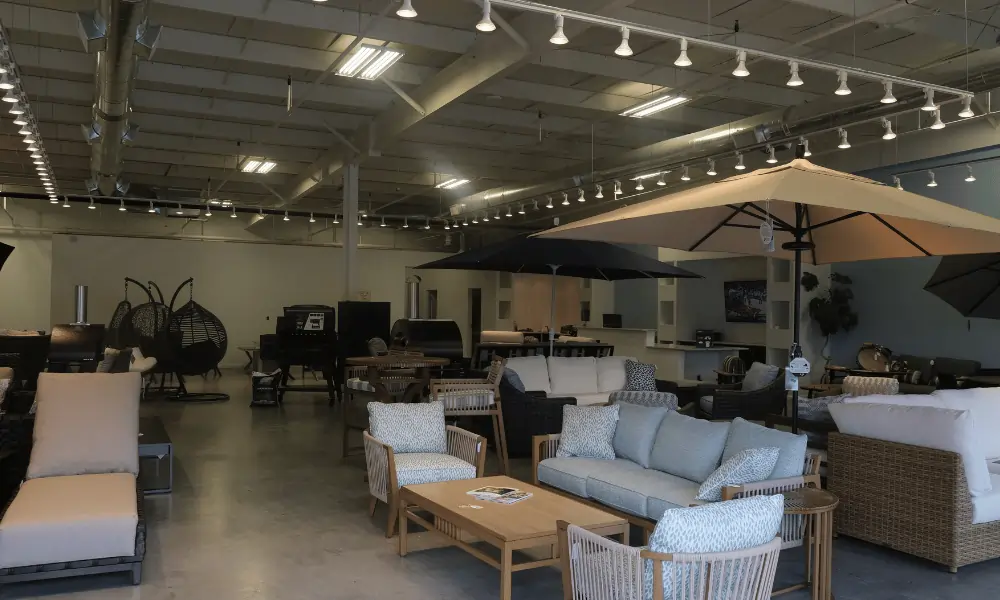 Greater Southern showroom with patio furniture, umbrellas, and grills.