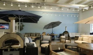 Outdoor patio sectional and umbrellas inside an Atlanta outdoor furniture store showroom